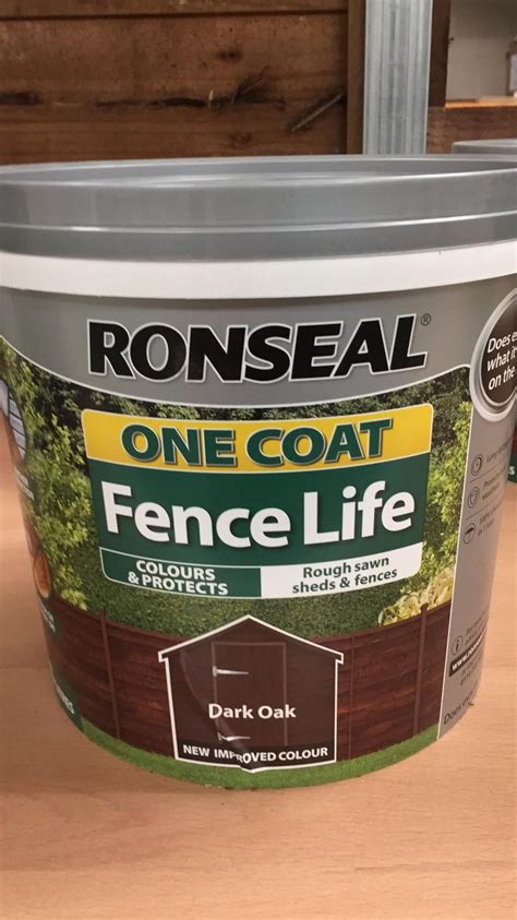 asda fence paint dark oak.